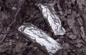 Wrapped food on the fireplace.