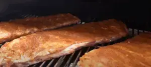 Ribs ion the cooking grate.